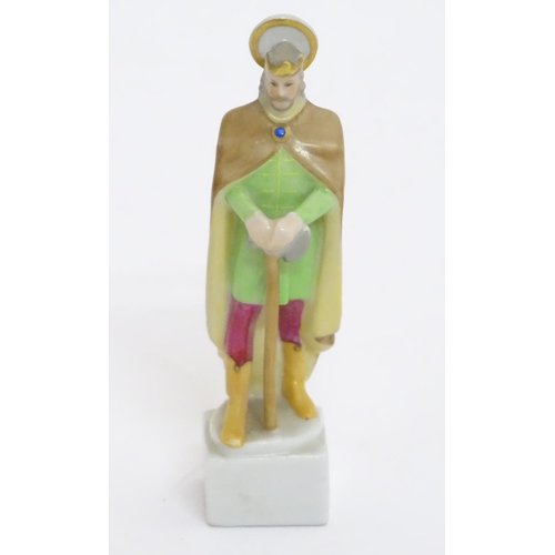 124 - A Herend pottery figure modelled as a Saint. Marked under. Approx. 4