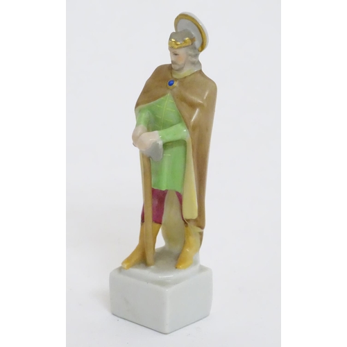 124 - A Herend pottery figure modelled as a Saint. Marked under. Approx. 4