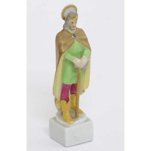 124 - A Herend pottery figure modelled as a Saint. Marked under. Approx. 4