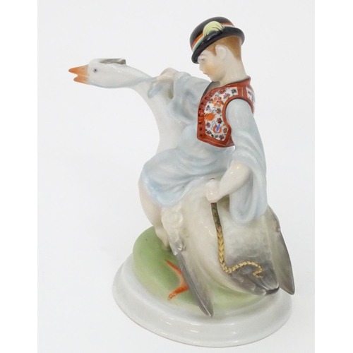 125 - A Herend pottery model of Ludas Matyia / Mattie the Goose-Boy, depicting a young boy riding a goose.... 