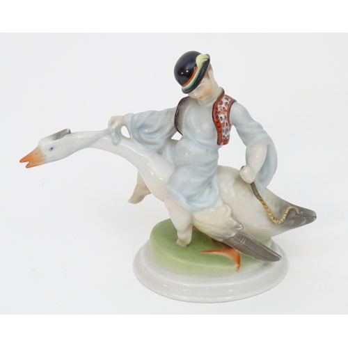 125 - A Herend pottery model of Ludas Matyia / Mattie the Goose-Boy, depicting a young boy riding a goose.... 