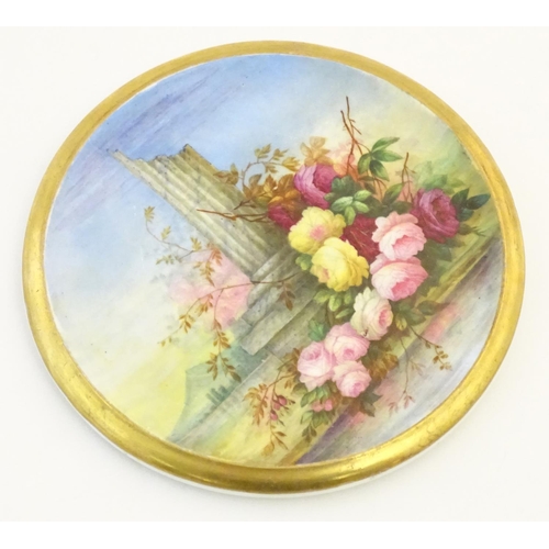 143 - A 19thC roundel in the manner of Derby with hand painted decoration depicting an Italian landscape s... 