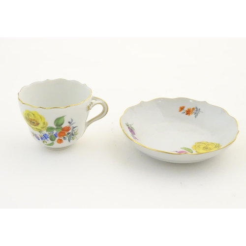 100 - A pair of Continental vases with relief floral decoration. Together with a tea cup and saucer with f... 