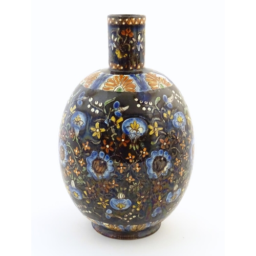 101 - A Thoune style vase with a bulbous body decorated with scrolling floral and foliate detail. Approx. ... 