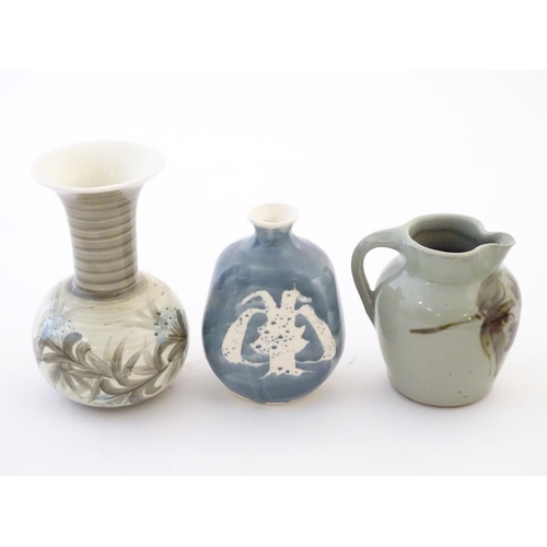 114 - Three studio pottery items comprising a small jug by Caroline Eeles with floral and foliate detail, ... 