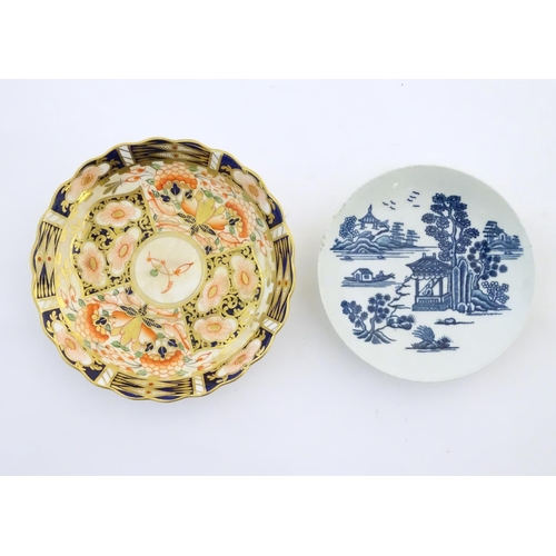 119 - A Royal Worcester blue and white saucer with Oriental landscape detail. Marked with crescent moon un... 