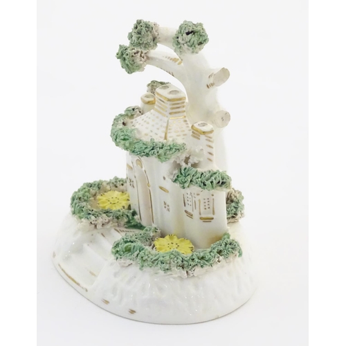 77 - A Staffordshire pottery model of a cottage. Approx. 4 1/4