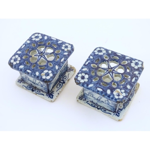 86 - Two Delft blue and white miniature stove / burners of squared form, the three side panels decorated ... 