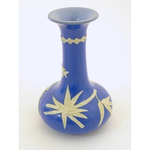 90 - A Dudson Brothers jasperware style vase with bird and bamboo decoration. Together with a blue and wh... 