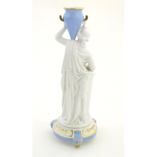 96 - A Continental model of a classical / mythological figure with a star crown, holding a blue twin hand... 