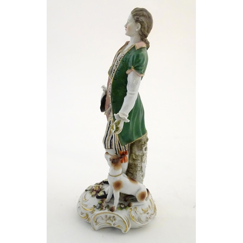 97 - Two German porcelain figures, a model of a young man holding a hat and flower with a dog beside him,... 