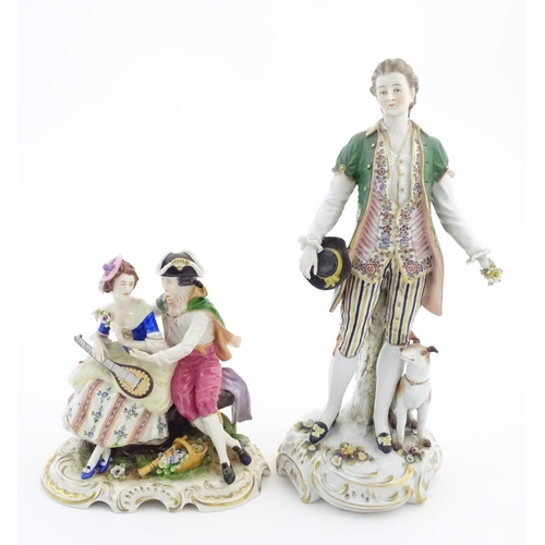 97 - Two German porcelain figures, a model of a young man holding a hat and flower with a dog beside him,... 