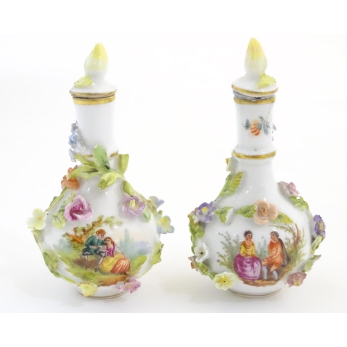 100 - A pair of Continental vases with relief floral decoration. Together with a tea cup and saucer with f... 