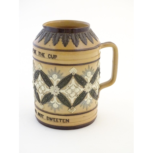 136 - A Doulton Lambeth stoneware verse tankard, with relief foliate detail and the motto Bitter Must Be T... 