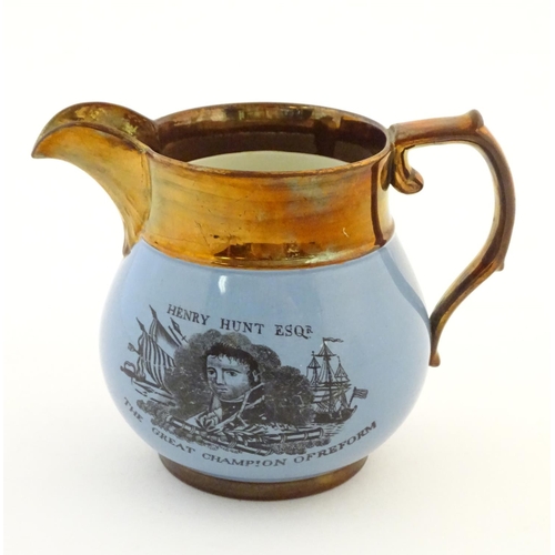 137 - A 19thC jug commemorating Peterloo, the bulbous body with a blue glaze decorated with a portrait of ... 