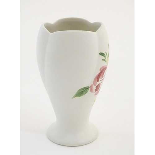 139 - A Radford hand painted vase with floral and foliate detail. Marked under. Approx. 5 1/2