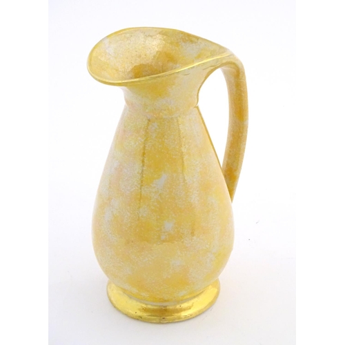 140 - A Govancroft Glasgow pottery jug with yellow spongeware decoration. Approx. 9