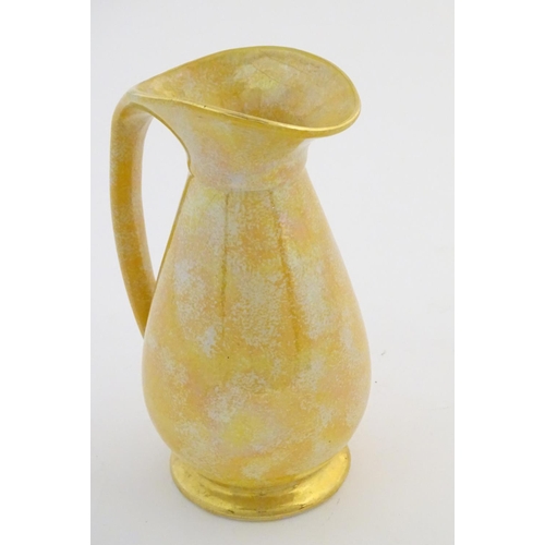 140 - A Govancroft Glasgow pottery jug with yellow spongeware decoration. Approx. 9