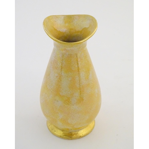 140 - A Govancroft Glasgow pottery jug with yellow spongeware decoration. Approx. 9