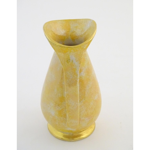 140 - A Govancroft Glasgow pottery jug with yellow spongeware decoration. Approx. 9