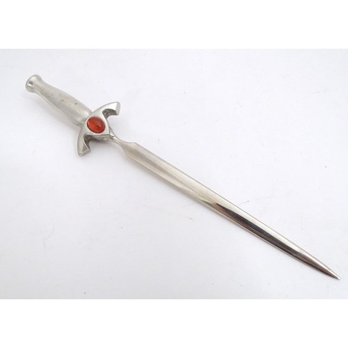 1831 - A 20thC letter opener modelled as a sword with cabochon detail to hilt. Approx. 6