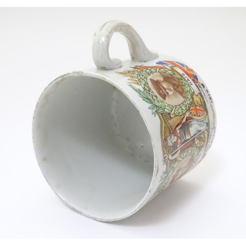 1015 - Militaria: an early 20thC ceramic mug with First World War / WWI / World War 1 commemorative decorat... 