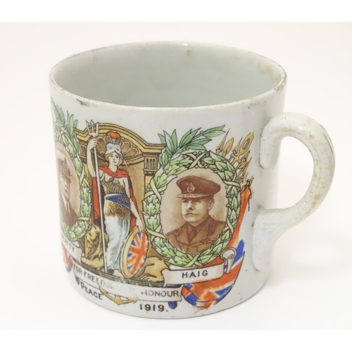 1015 - Militaria: an early 20thC ceramic mug with First World War / WWI / World War 1 commemorative decorat... 