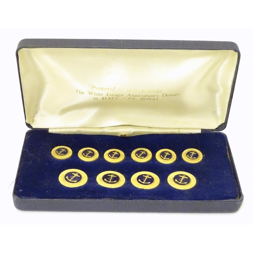 1027 - Militaria: a boxed presentation set of naval tunic buttons, each with anchor decoration, the case in... 