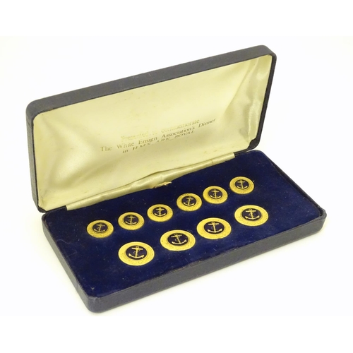 1027 - Militaria: a boxed presentation set of naval tunic buttons, each with anchor decoration, the case in... 