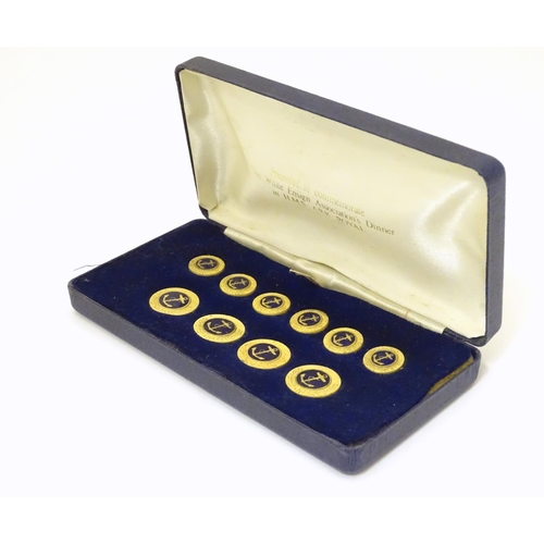 1027 - Militaria: a boxed presentation set of naval tunic buttons, each with anchor decoration, the case in... 