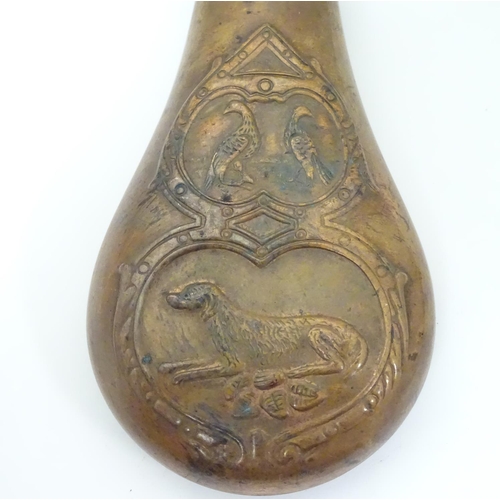 1028 - A 19thC copper and brass powder flask, decorated with gundog and gamebird motifs on both sides, 6 3/... 