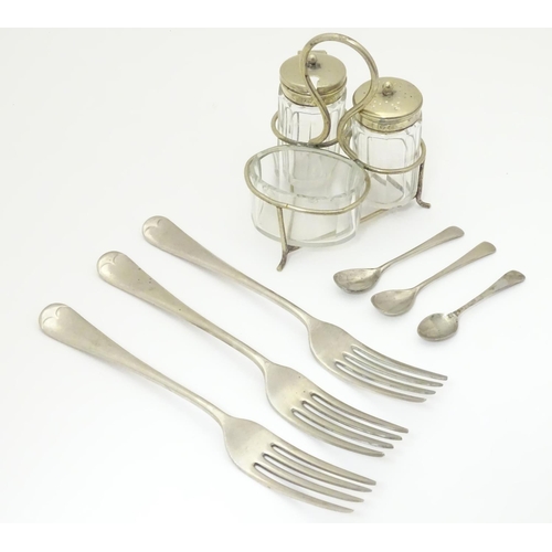 1034 - Militaria: an assortment of silver plated tableware comprising cruet set, three forks and two condim... 