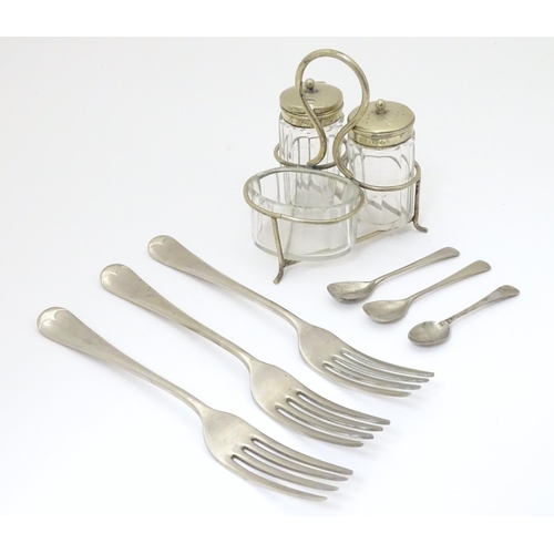 1034 - Militaria: an assortment of silver plated tableware comprising cruet set, three forks and two condim... 