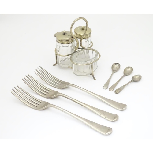 1034 - Militaria: an assortment of silver plated tableware comprising cruet set, three forks and two condim... 