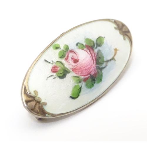 925 - A silver brooch with guilloche enamel and hand painted rose detail. Marked to reverse 925 KS. Approx... 