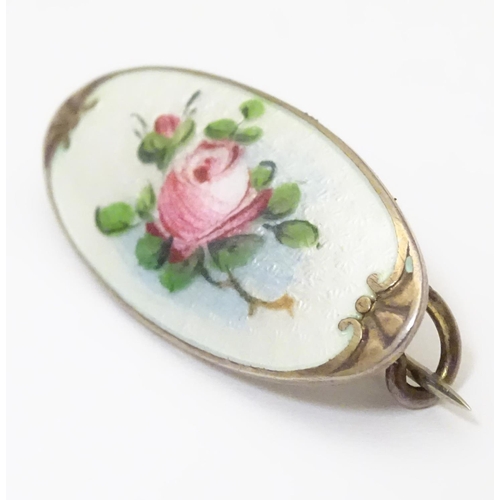 925 - A silver brooch with guilloche enamel and hand painted rose detail. Marked to reverse 925 KS. Approx... 