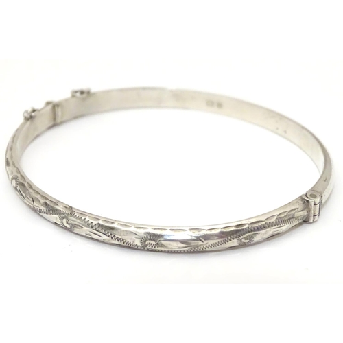 926 - A silver bracelet of bangle form, hallmarked Birmingham 1988