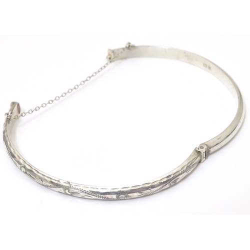 926 - A silver bracelet of bangle form, hallmarked Birmingham 1988