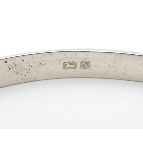 926 - A silver bracelet of bangle form, hallmarked Birmingham 1988