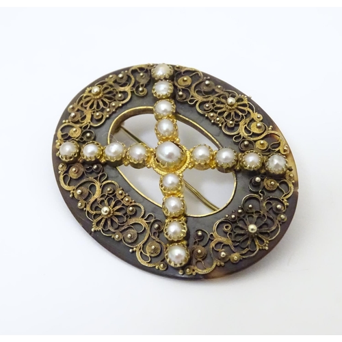 934 - A Victorian tortoiseshell brooch with gilt metal filigree detail and seed pearls. Approx. 1 1/2