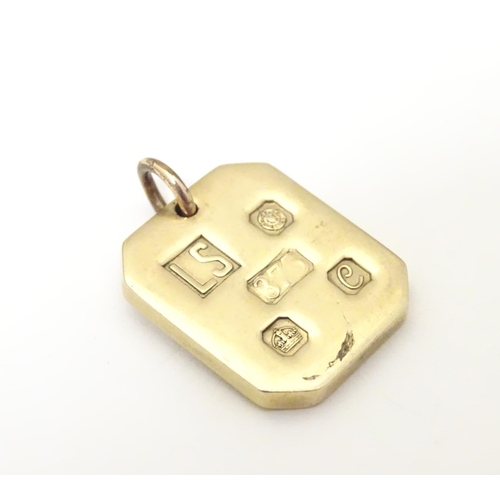 935 - A 9ct gold pendant of ingot form, hallmarked Sheffield, 1977, maker LS. Approx. 1