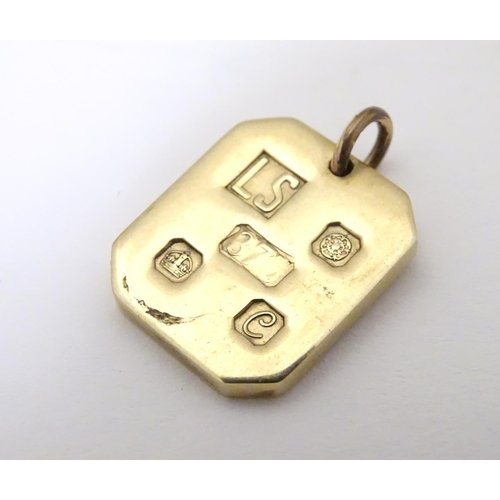 935 - A 9ct gold pendant of ingot form, hallmarked Sheffield, 1977, maker LS. Approx. 1