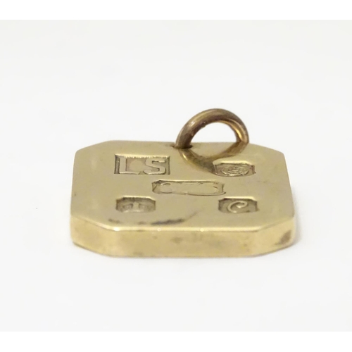 935 - A 9ct gold pendant of ingot form, hallmarked Sheffield, 1977, maker LS. Approx. 1