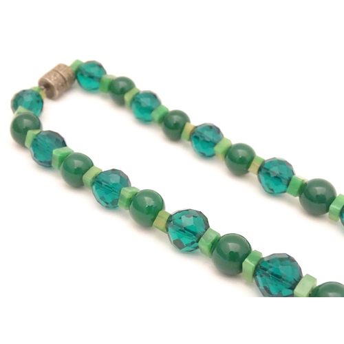 944 - Two vintage bead necklaces, both with various green beads. The longest approx 32