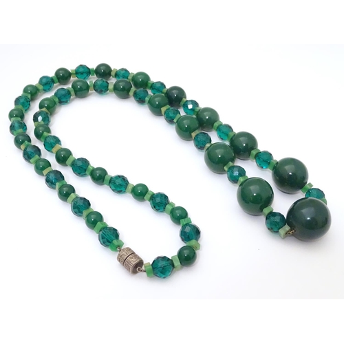 944 - Two vintage bead necklaces, both with various green beads. The longest approx 32