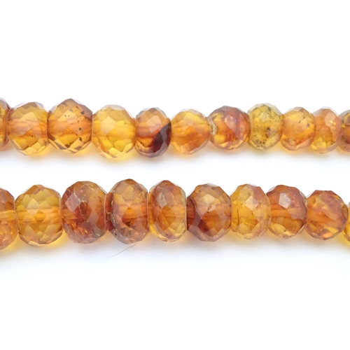 945 - A graduated bead necklace of facet cut amber coloured beads Approx 32