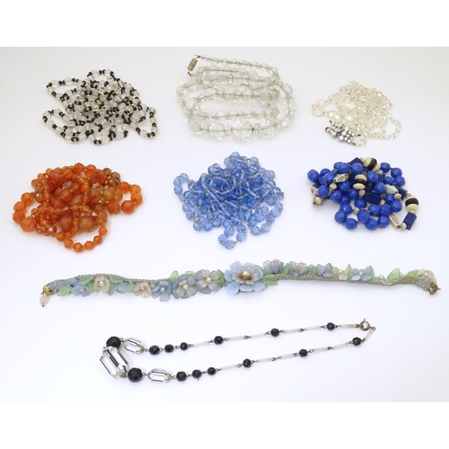 949 - A quantity of assorted vintage bead necklaces , various examples.