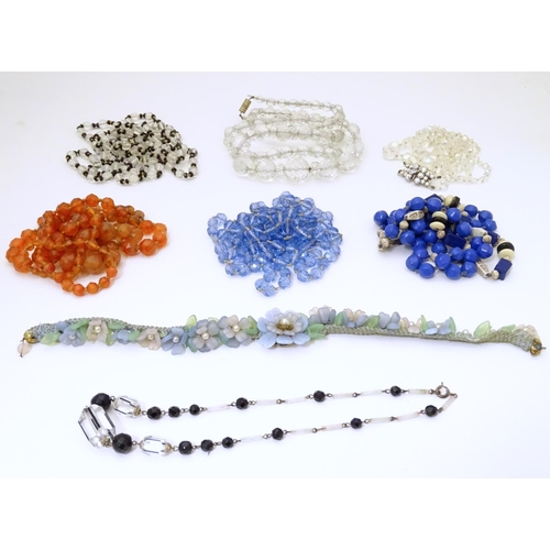 949 - A quantity of assorted vintage bead necklaces , various examples.