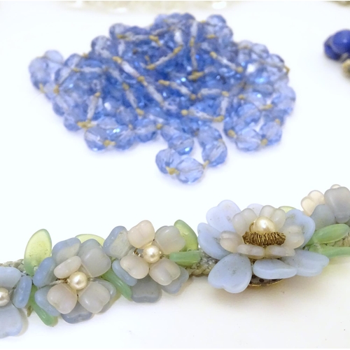 949 - A quantity of assorted vintage bead necklaces , various examples.