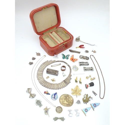 950 - A jewellery box containing assorted jewellery badges, pins, brooches, necklaces etc